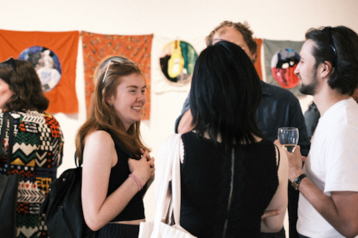 A group of people enjoying an opening at ATW