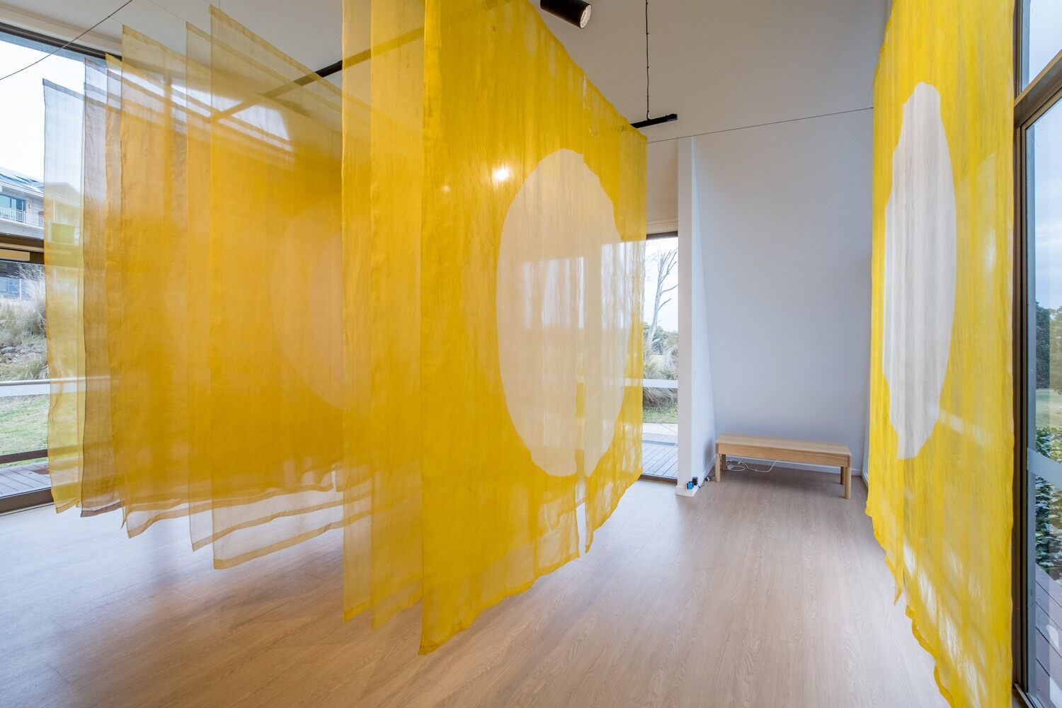 Sangeeta Sandrasegar ‘Yellow deep that drew your eyes’, 2024 Installation of 11 works, Hand-dyed silk organza and khadi silk organza, Installation views, RACV Arthouse, Creswick 