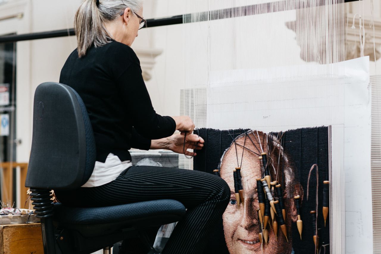 ATW weaver Pamela Joyce working on portrait of John B Reid AO, 2019. Photo by Marie-Luise Skibbe. 