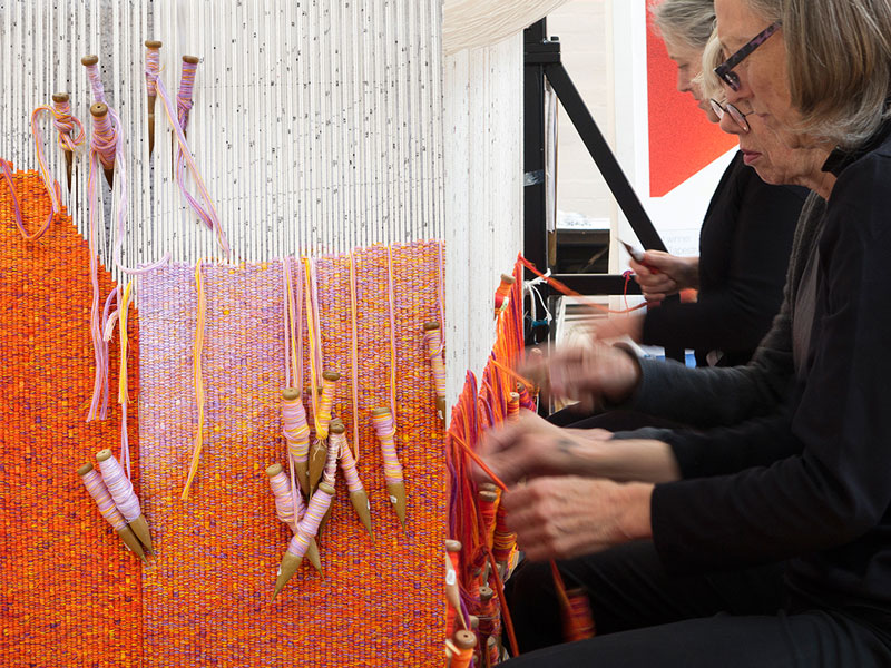 Left: Detail: 'Perspectives on a Flat Surface,' 2016, John Wardle Architects. Photograph: ATW. Right: ATW weavers working on 'Perspectives on a Flat Surface,' 2016, John Wardle Architects. Photograph: ATW. 